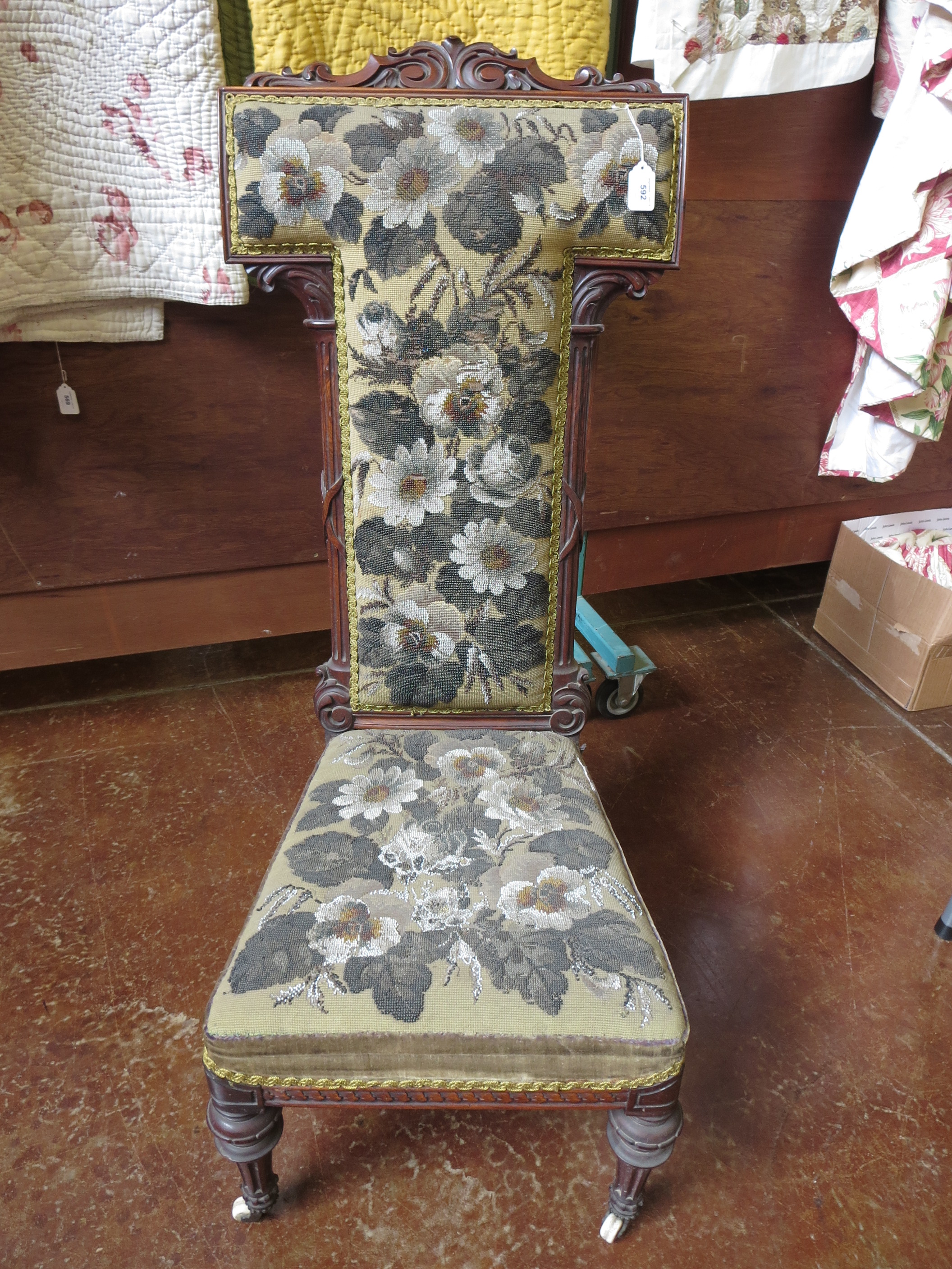 A beaded prieu dieu, the seat and back completely embroidered with gold, white and orange beads.