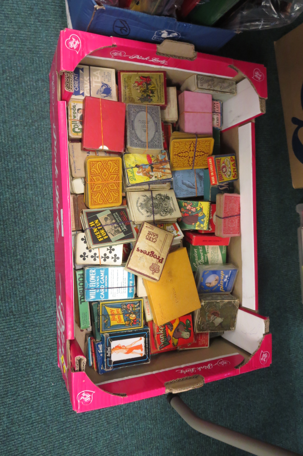 A box of playing cards including ‘Cadburys Assorted Chocolates’, ‘Jungle Jinks’, ‘Spelling Bee’, ‘