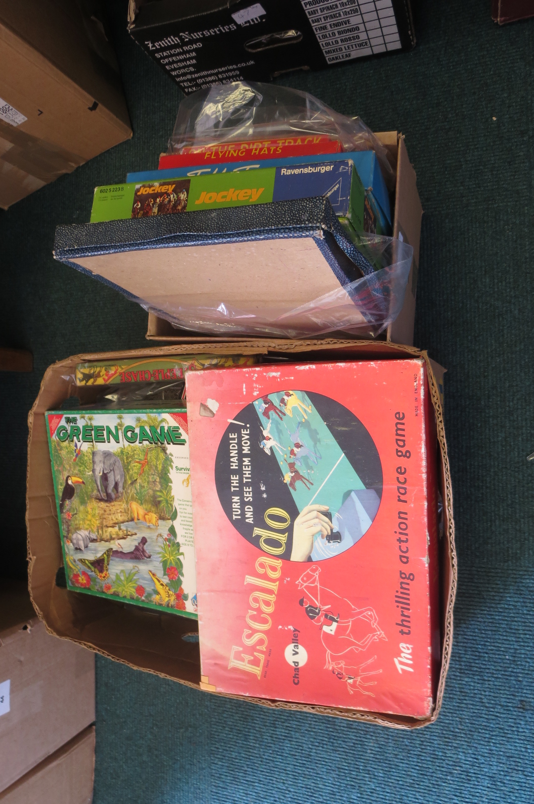 Two boxes of board games including ‘On the dirt track’, ‘Flying Hats’, ‘Escalado’, ‘Fish Pond’, ‘