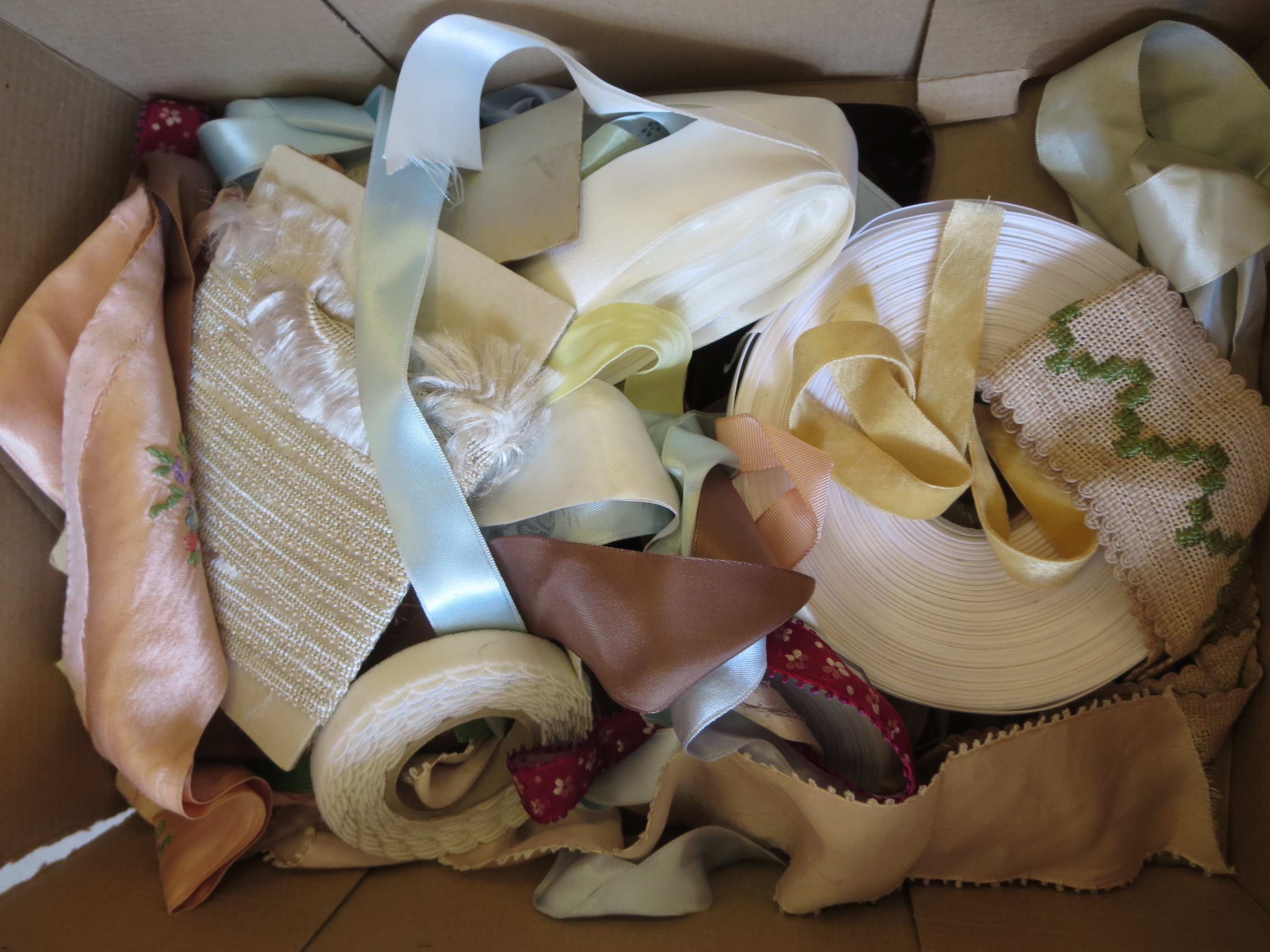 A box of old ribbons, insertions etc