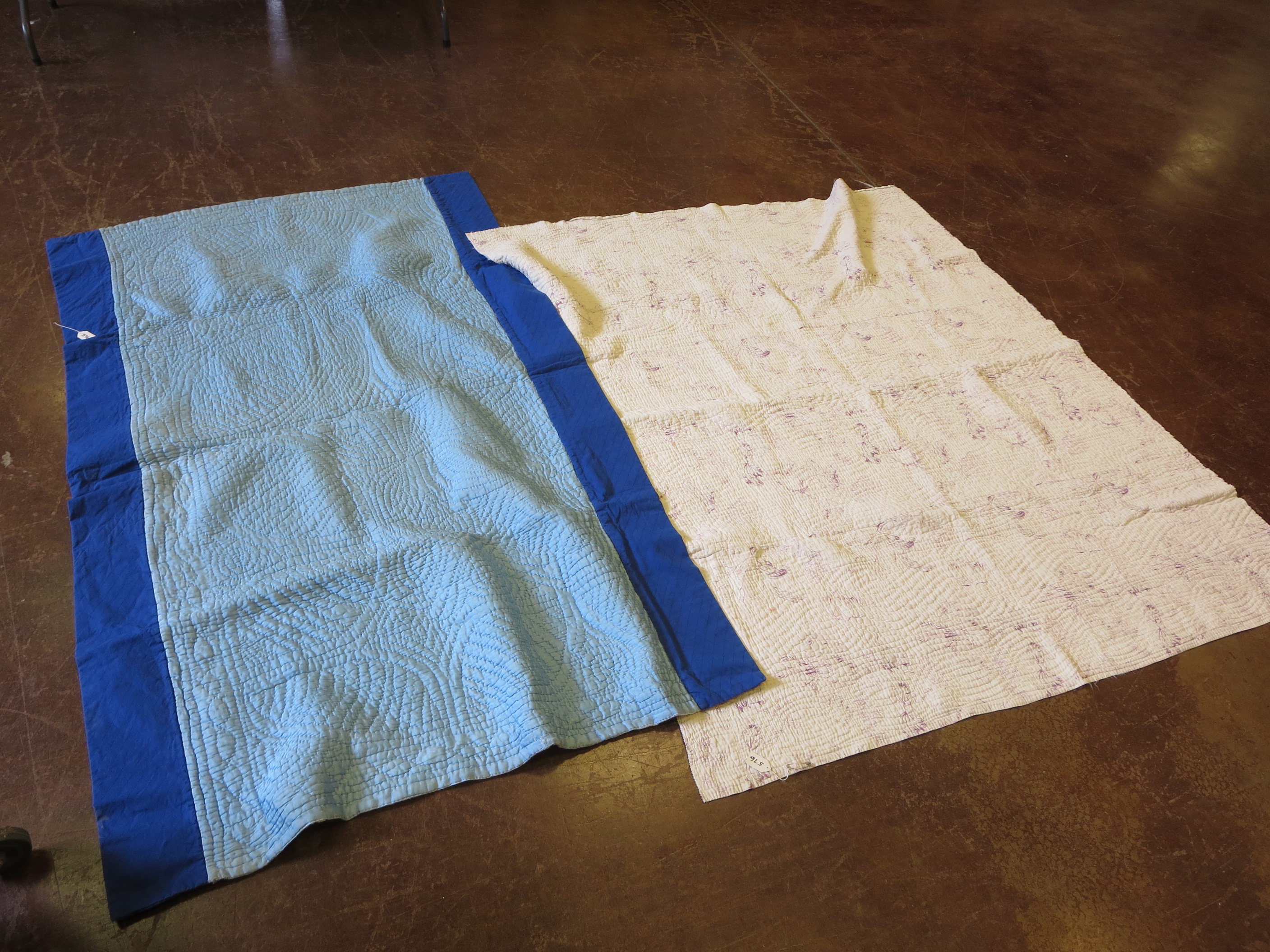 A cream and purple Welsh quilt and a blue and royal blue Welsh quilt (2)