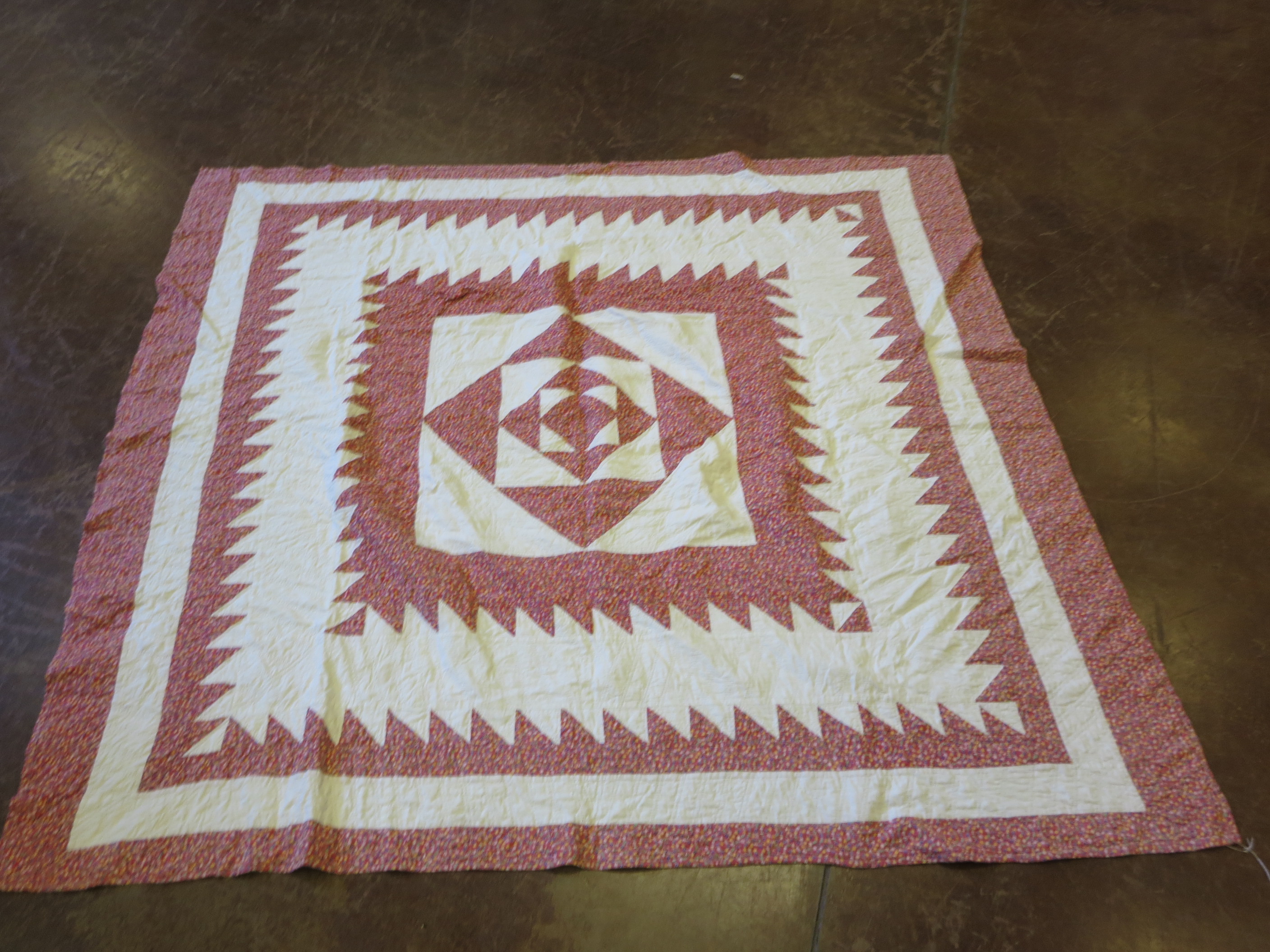 A mainly red and white patchwork quilt, verso red flowered pattern, 76 x 75