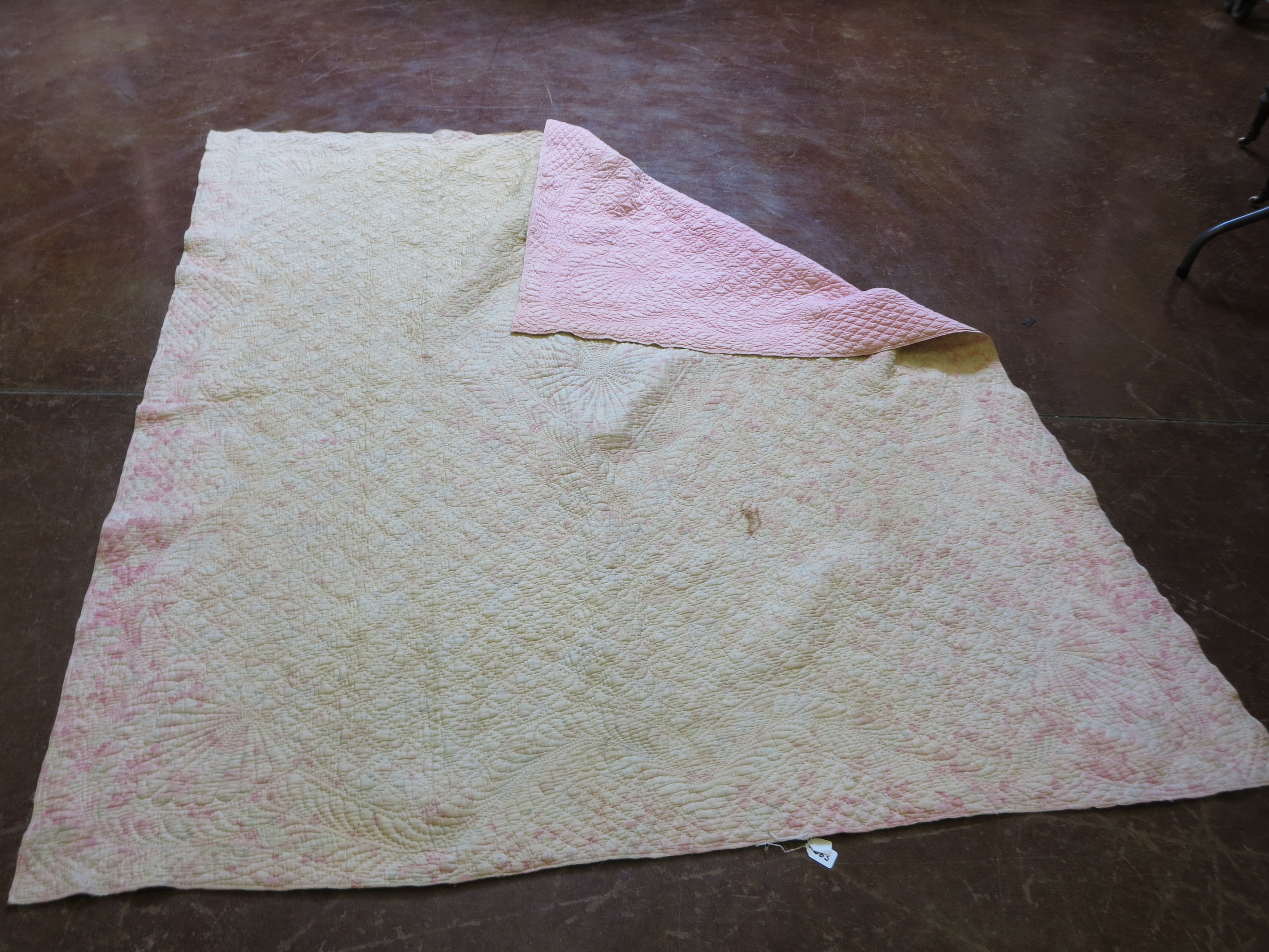 A Welsh type pastel coloured quilt. Pink verso. Some marking. Circa 1900