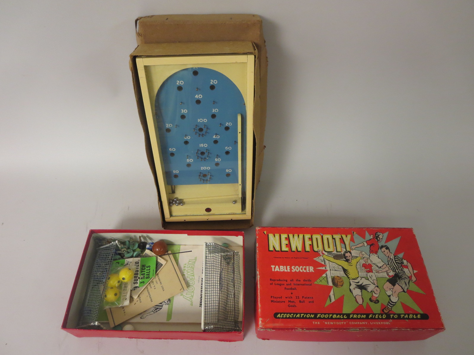 A boxed ‘New Footy’ table soccer game and a Chad Valley boxed bagatelle board