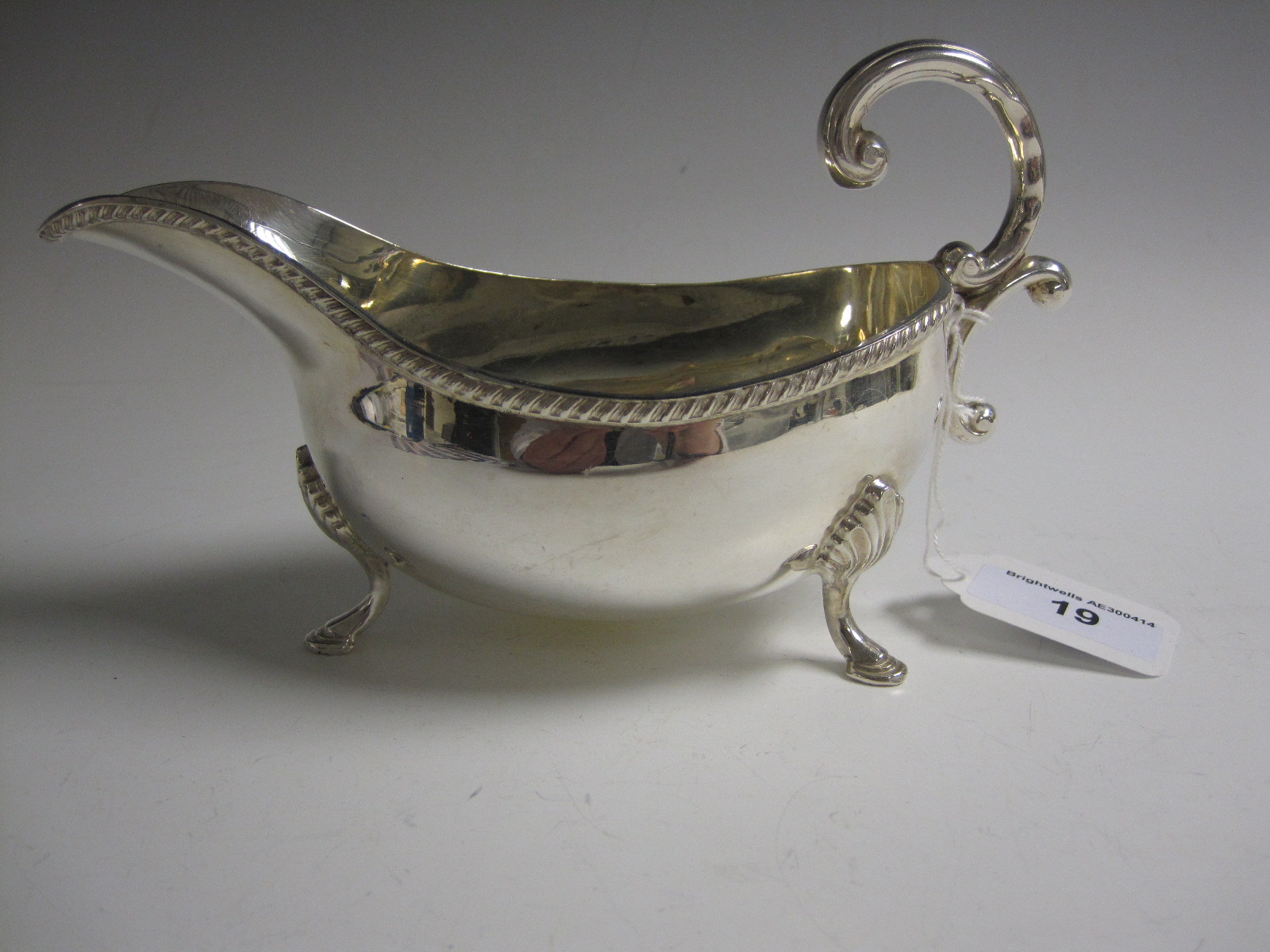 A Georgian style silver Sauce Boat with scroll handle and gadroon rim, Birmingham 1972