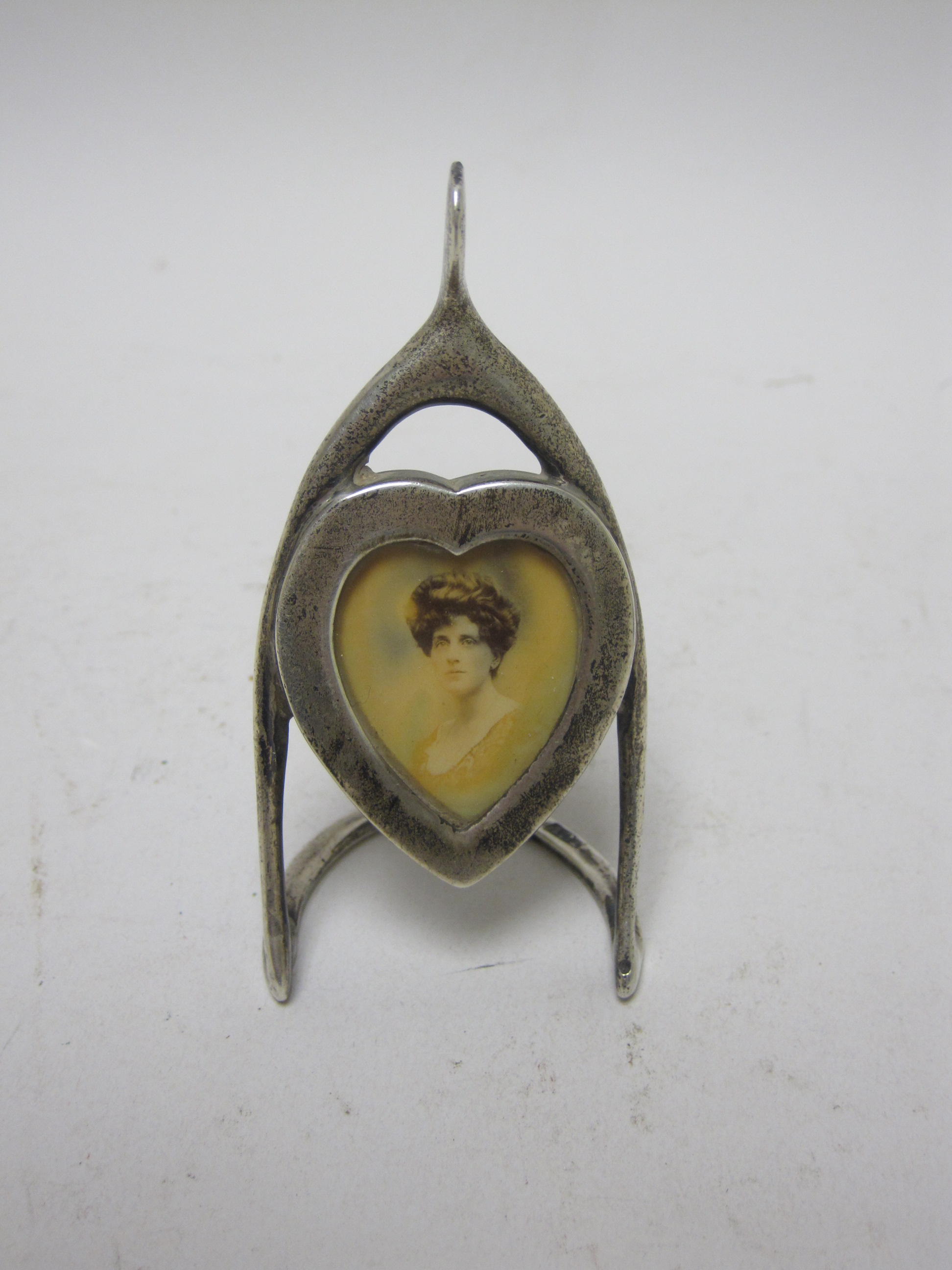 An Edward VII silver heart shape Photograph Frame with wishbone surround, London 1906