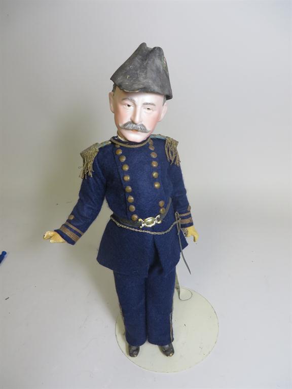 A German made bisque portrait doll of Charles Dwight Sigsbee (1845-1923), commander of the