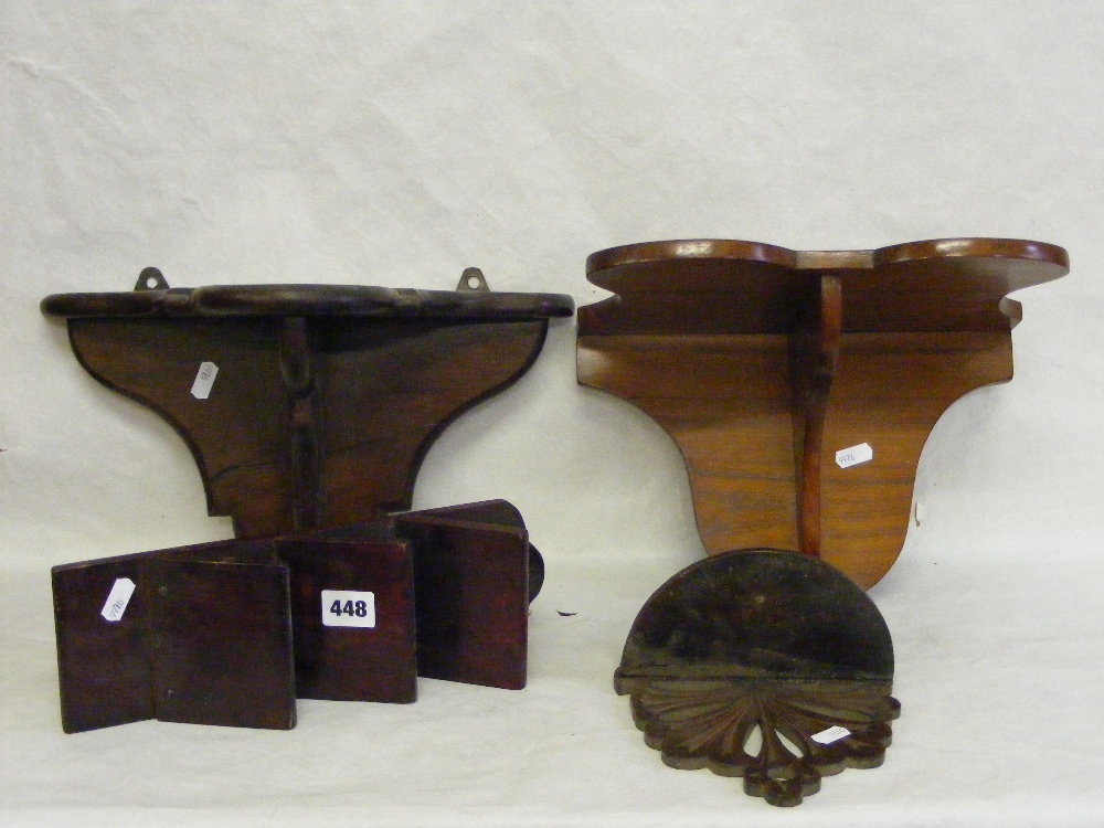 Three wooden wall brackets and a wooden letter rack.