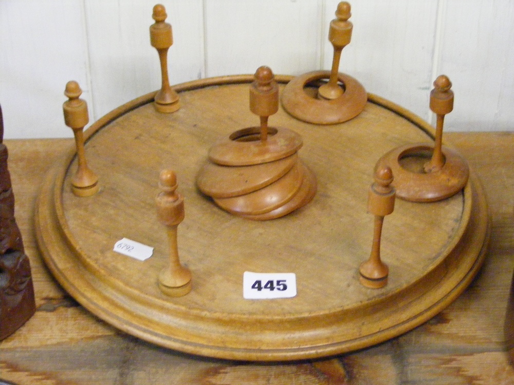 A treen table top quoits game.