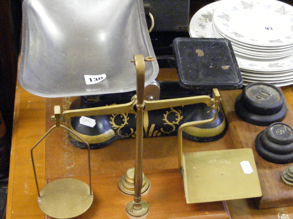 A set of antique postal scales and a set of provision scales and weights.