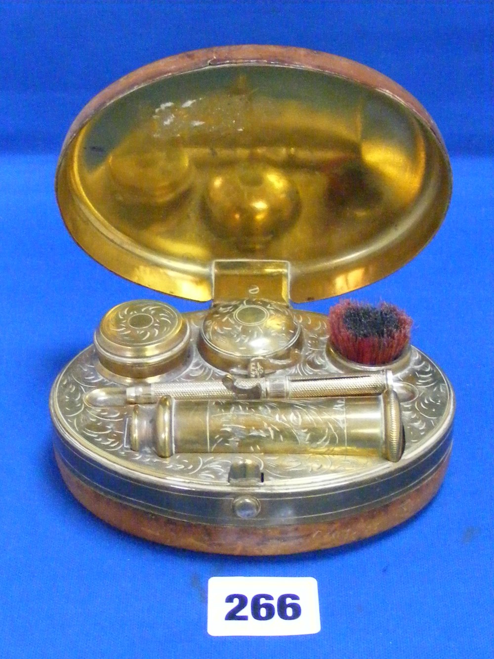 A very nice leather covered brass travelling Victorian inkwell with button clasp opening to reveal a