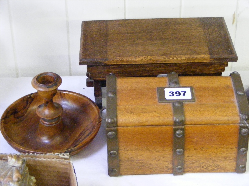 A vintage musical box in the form of a refectory table, a treen night stick and a musical