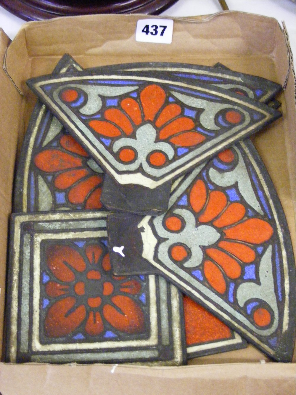 An enamelled set of metal inserts, possibly from a hanging lamp.