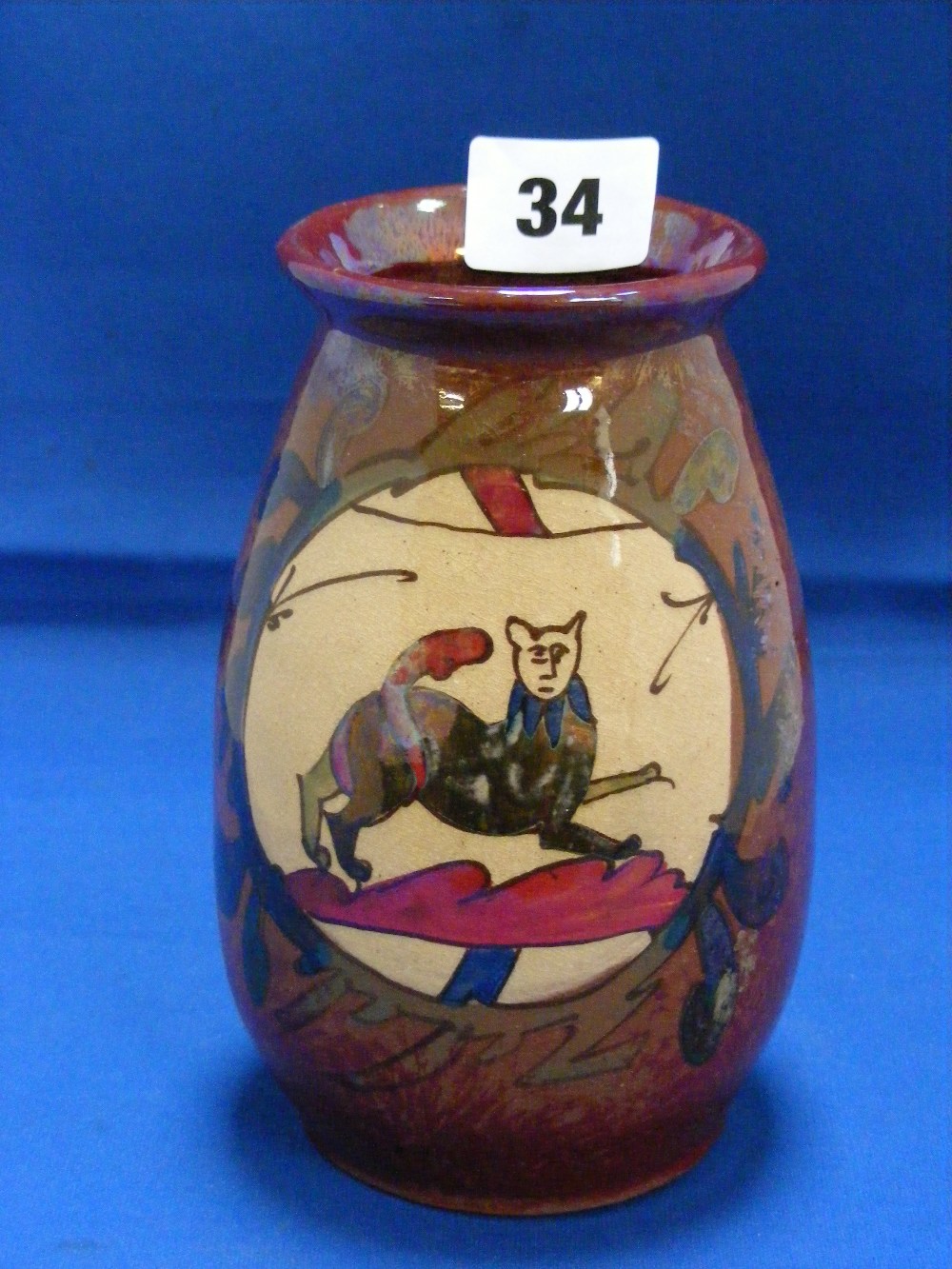 An unusual Denby Art vase with two panels depicting Bayeux Tapestry style scenes and finished with