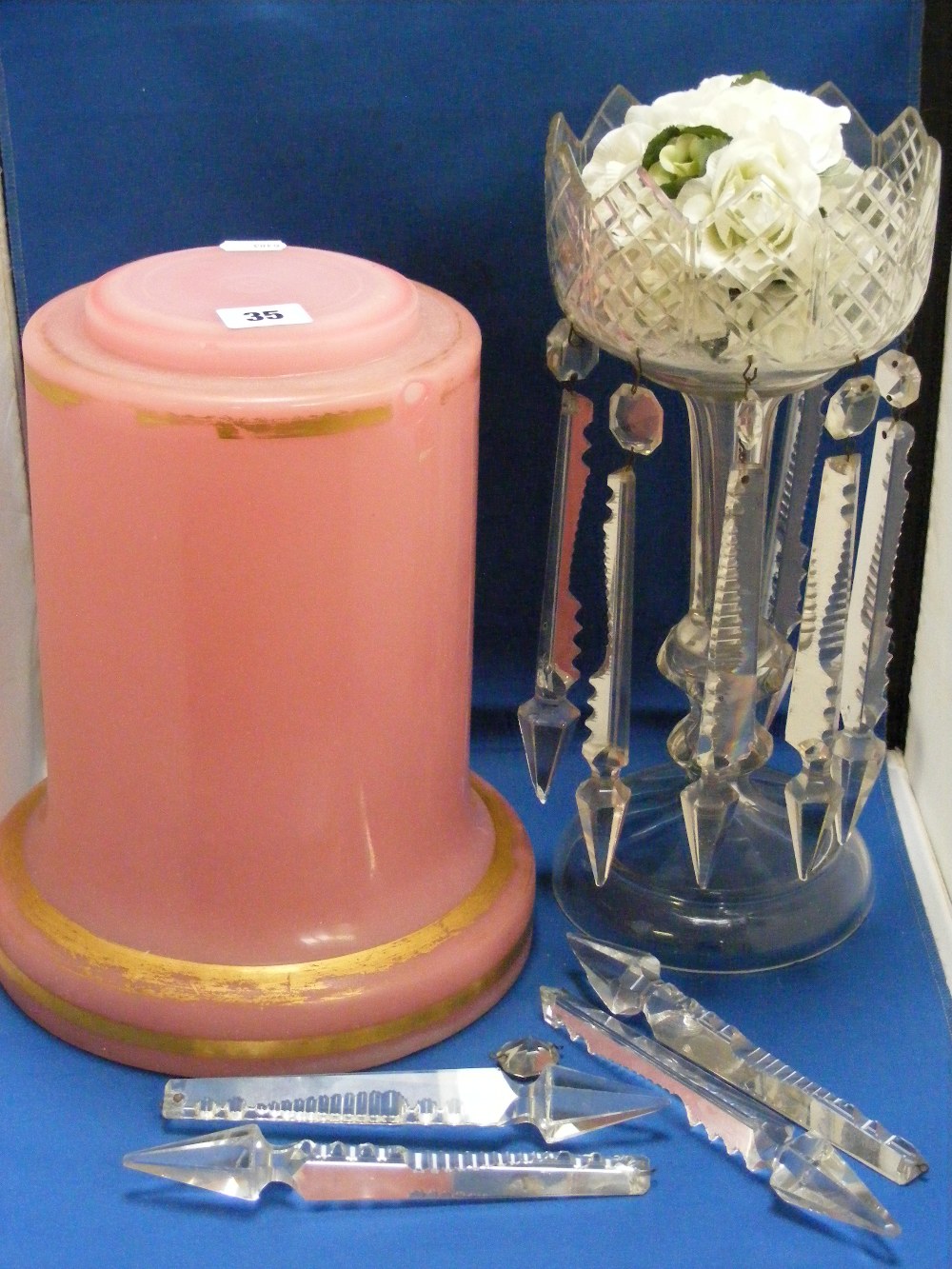 A Victorian lustre in clear glass with clear glass drops, together with a circular pink glass
