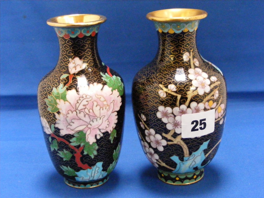 A pair of good quality Cloisonne vases with striking floral decoration on a black ground. Height 6