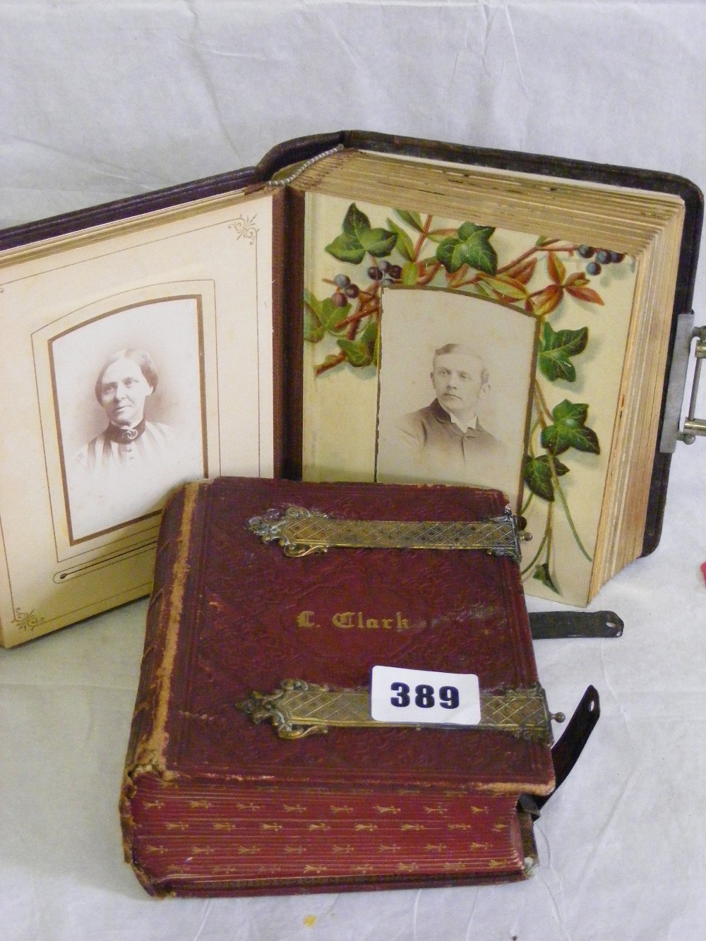 Two Victorian brass clasped photo albums, one with finely tooled leather cover.