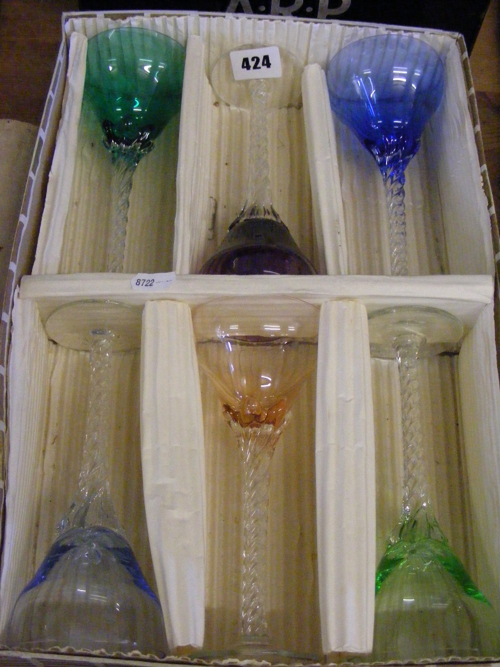 A box set of six vintage multi-coloured twist stem cocktail glasses.