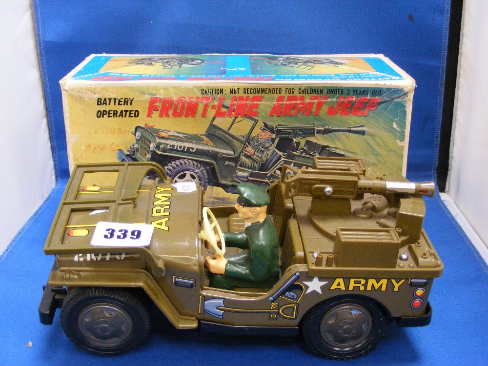 A boxed Japanese Front-Line army jeep tinplate & plastic battery operated, with 5 big actions, gun