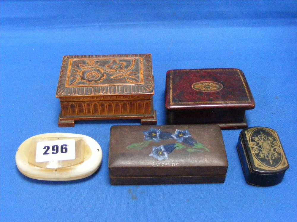 A poker work snuff box, a horn snuff box, a French papier-mâché snuff box, an inlaid treen stamp box