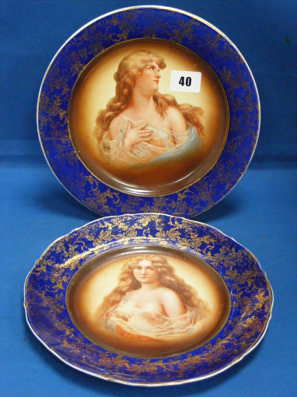 A pair of late 19th/early 20th Century continental porcelain plates of contrasting shape, both