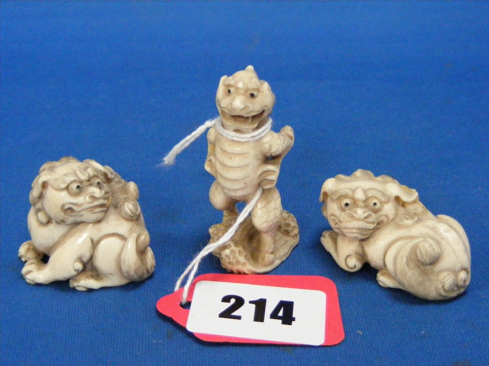 Two Japanese carved ivory Netsuke of Temple dragons, both signed, plus a carved ivory Netsuke of a