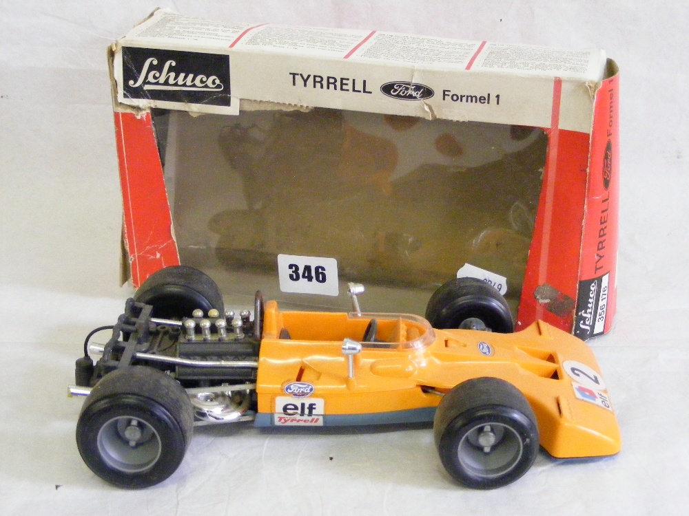 A boxed Schuco die-cast Tyrrell F1 car.