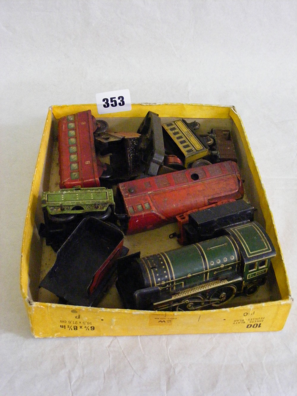 Two small tinplate clockwork engines with tenders.