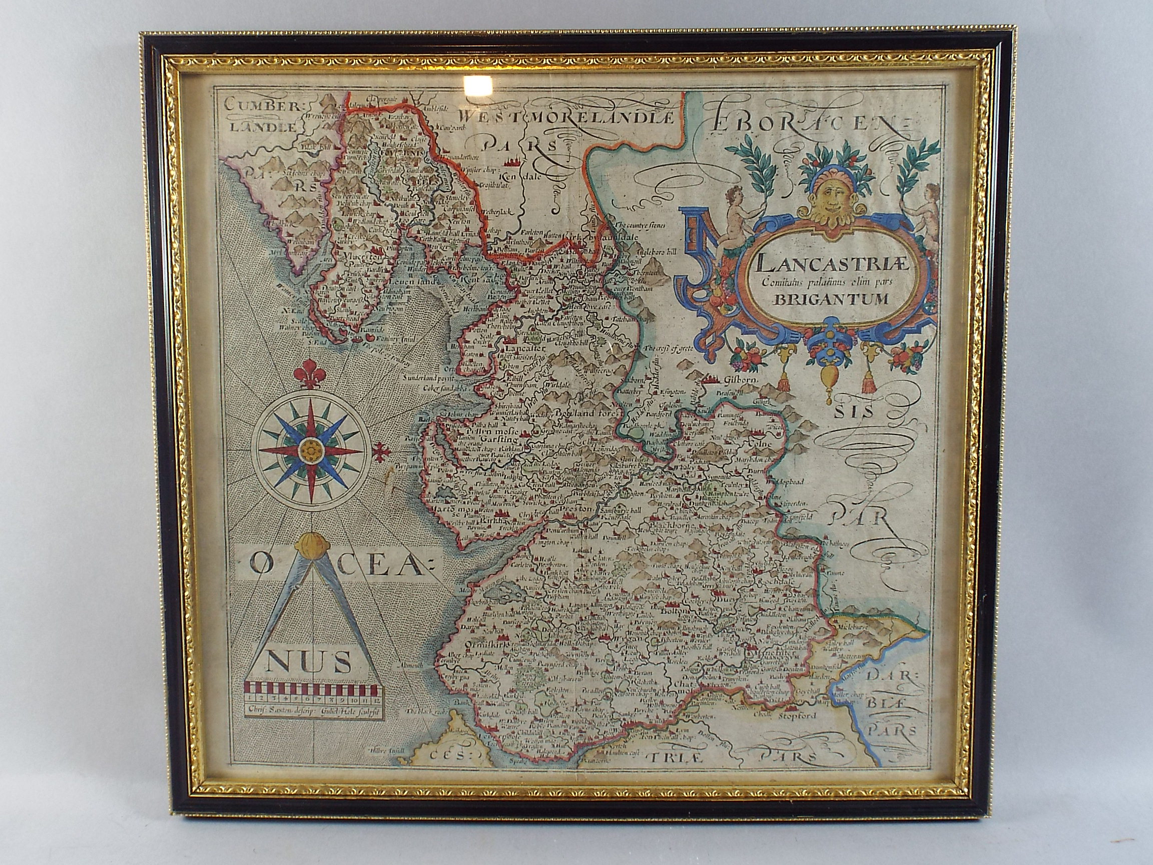 A Framed Hand Coloured Map of Lancashire By Christopher Saxton, Engraved By Guliel Hole. 30.5x29.