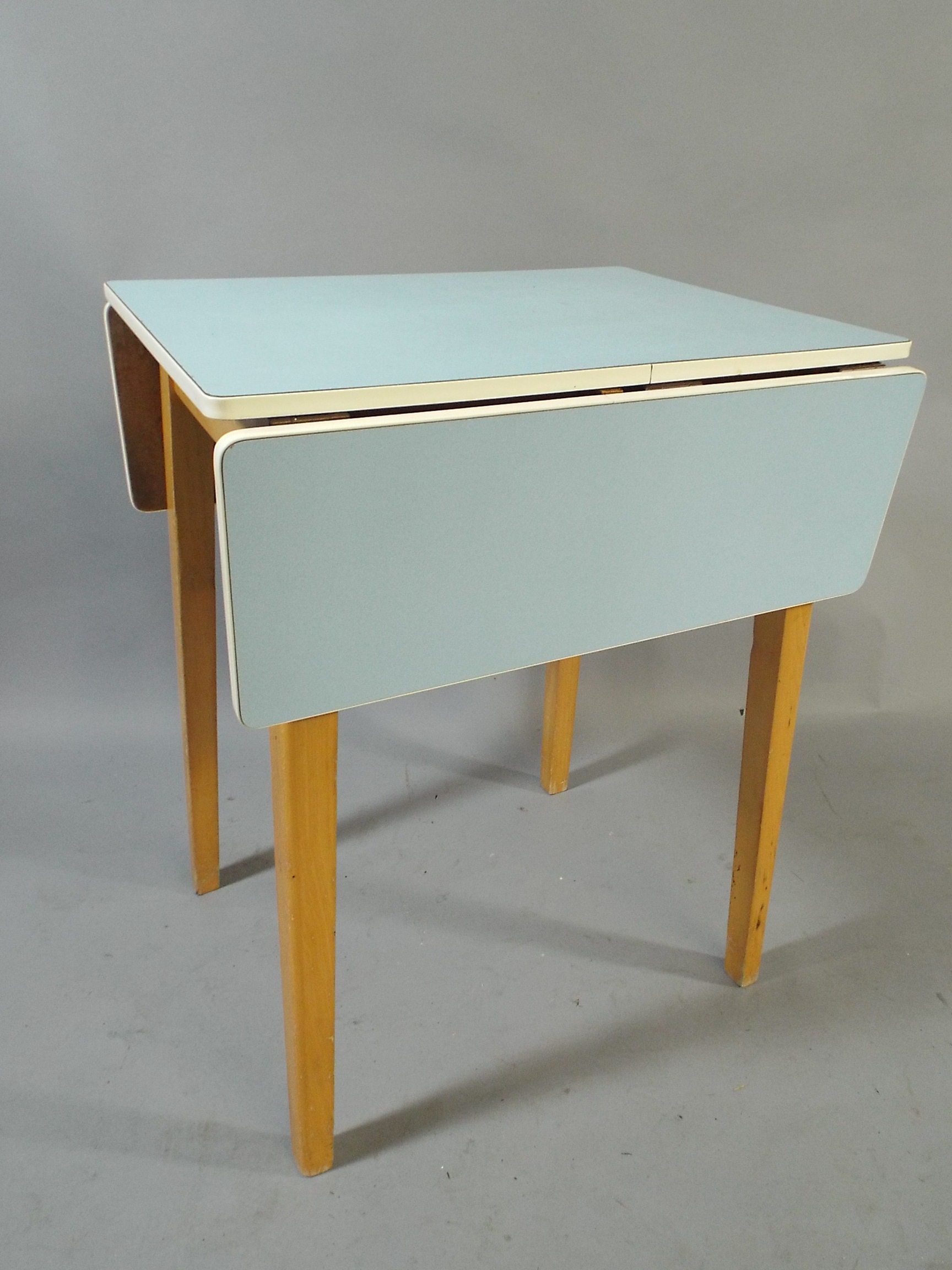 A 1950/60s Drop Leaf Kitchen Table with Blue Formica Top. 60x48cm with Leaves folded.