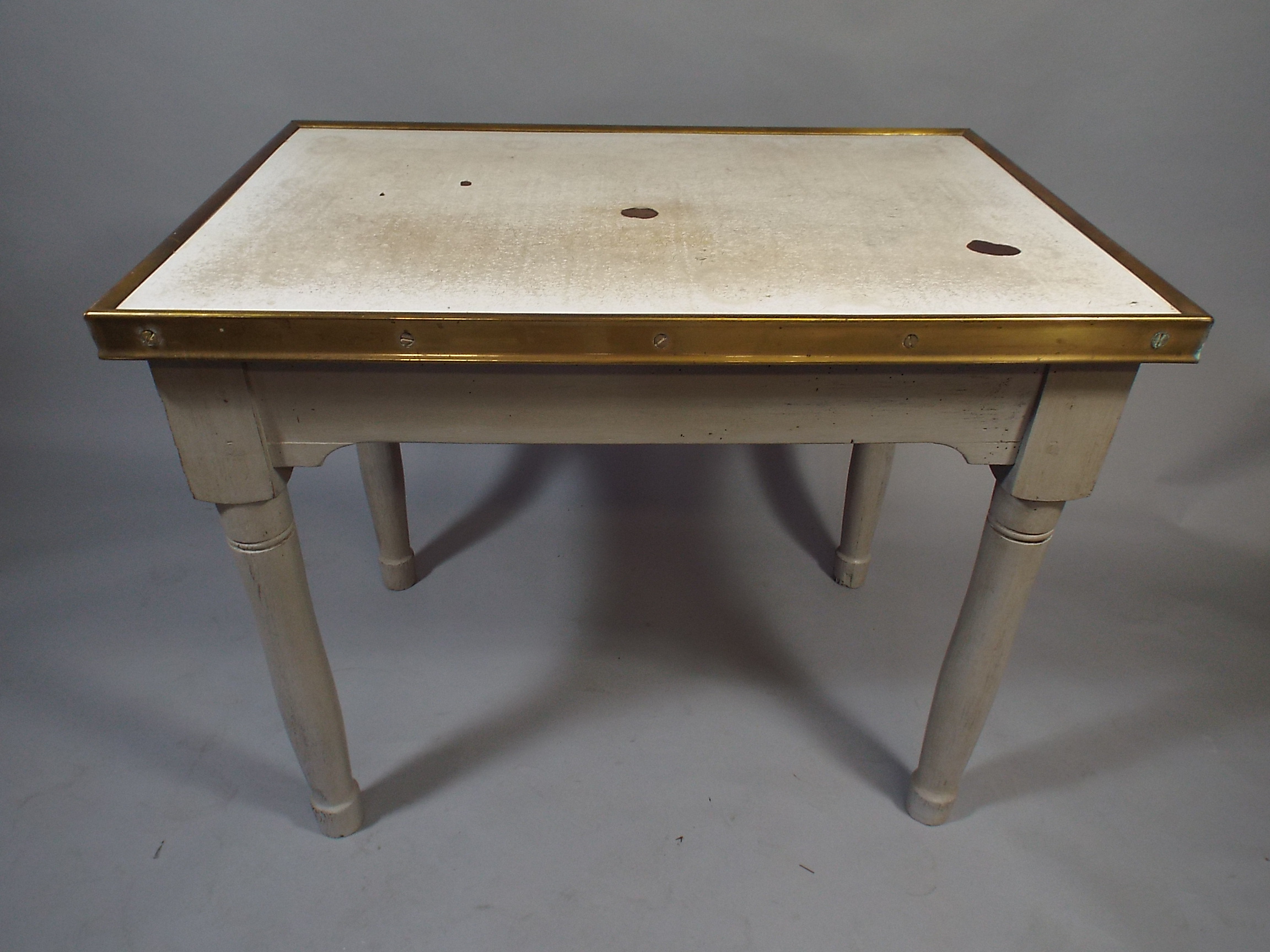 A 19th Century Dairy Table with a Brass Framed Enamel Top, Over Four Painted Turned Legs.