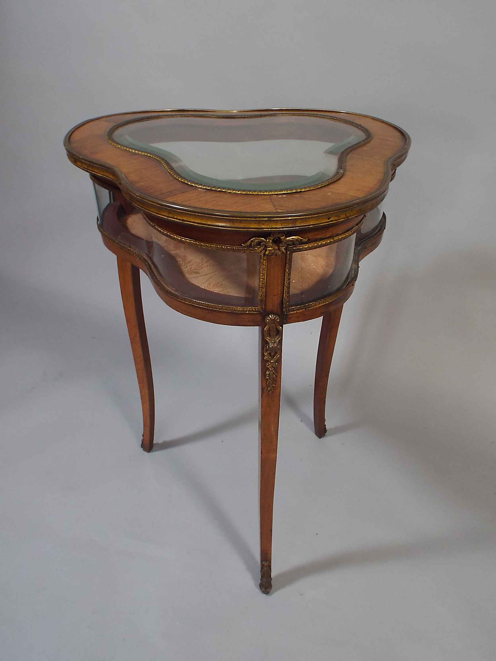 A Pretty French Ormolu Mounted Rosewood Bijouterie Table with Clover Leaf Top on Cabriole Legs.