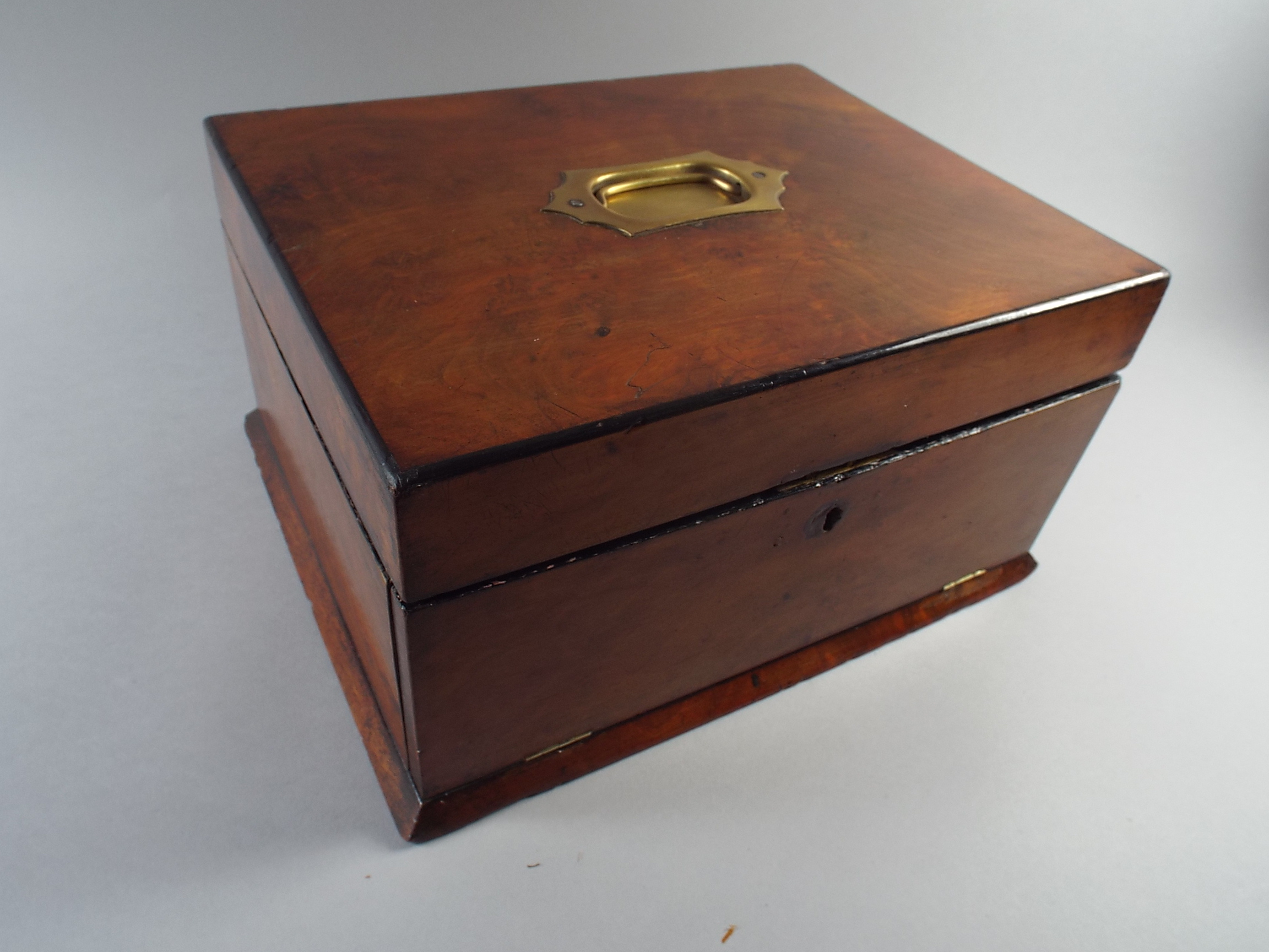 A Late 19th Century Walnut Work Box. The Hinged Lid Having Inset Brass Carrying Handle. Inner