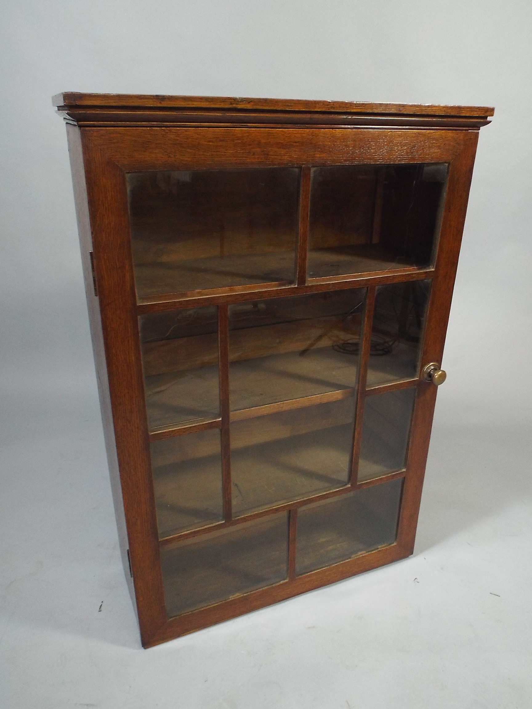 A 19th Century Oak Wall Hanging Cupboard, with a Moulded Cornice Over a Glazed Door with Nine