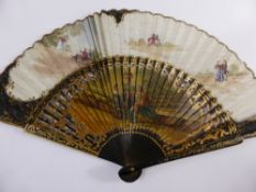 A vintage Spanish fan depicting three figures in period dress.