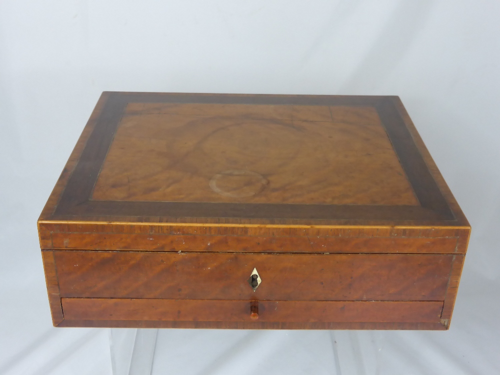 An Antique Georgian Sewing Box, fitted silk lined interior together with ivory sewing implements.