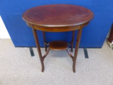 An Edwardian Banded Inlaid Oval Occasional Table, under shelf and stretchers, 68 x 47 x 73 cms