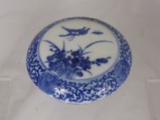 A Chinese Blue and White Ink Pot, of circular form, depicting butterflies and chrysanthemum,