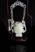 Chinese 20th Century White Jade Suspended Vase, the square shaped vase having ornately carved