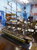 A vintage model of a four masted  "" Man of War "" sailing ship, est. length 122 cms. and 80 cms.