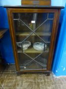 An Edwardian mahogany glazed front display cabinet having inlaid banding, est. 61 x 34 x 108 cms.