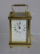 An English Brass Cased Carriage Clock, white enamel face with Roman dial, marked Worcester, approx