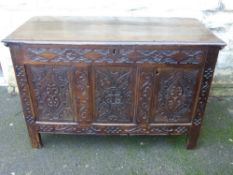 A circa 17th century oak chest having decorative carving to the front, est. 121 x 57  80cms.