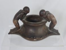 An Antique Earthenware Vessel, depicting two kneeling figures, approx 26 x 15 cms