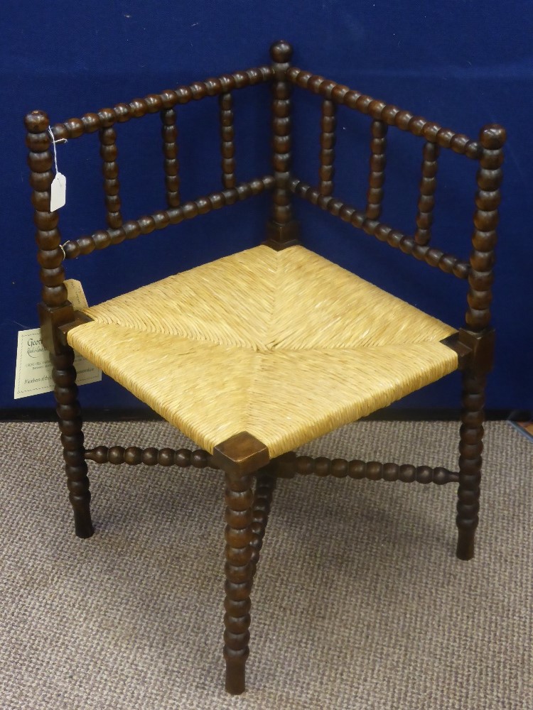 A Vintage Oak Bobbin Carved Corner Chair, the chair benefits from a new rush seat. - Image 2 of 2