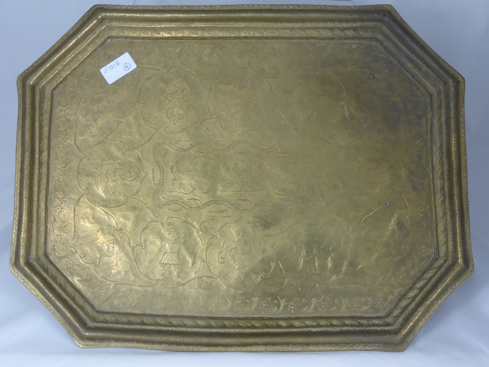 A 19th Century Indian Ornate Brass Serving Tray, engraved with Hindu deity and decorative floral