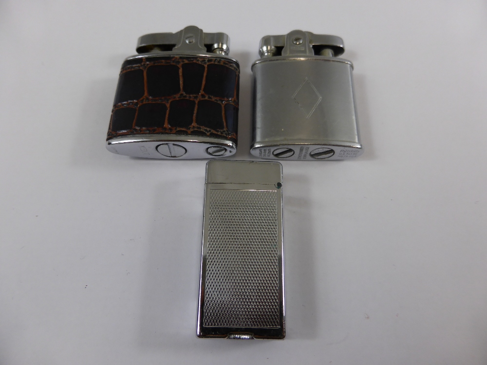 Three vintage lighters including a Ronson patent numbert 291695, a Kent and a Dunhill patent number