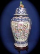 Chinese Famille Rose Temple Vase and Cover, the vase featuring a cobalt blue ground interspersed