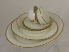 A part Limoges dinner service comprising eight dinner plates, eight smaller plates, eight side