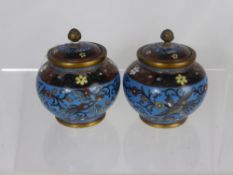 A Pair of Antique Oriental Cloisonne Lidded Pots, depicting birds in flight with flower bud finial`